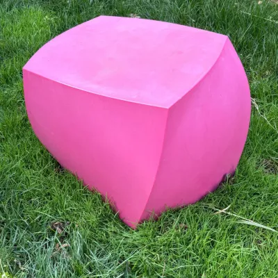 Sale Photo Thumbnail #11: Modern hot pink molded plastic stool or side table featuring a curved, geometric design.