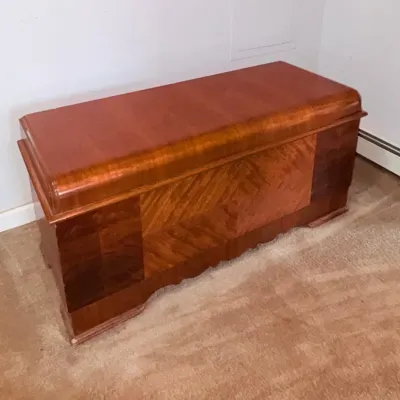 Sale Photo Thumbnail #166: Art Deco waterfall cedar chest featuring multi-toned wood veneers in a geometric pattern, circa 1930s-1940s.