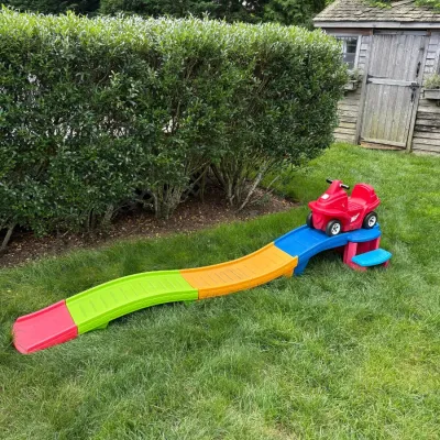 Sale Photo Thumbnail #121: Step2 Up & Down Roller Coaster toy featuring a multi-colored track and a red riding car, suitable for outdoor backyard play.