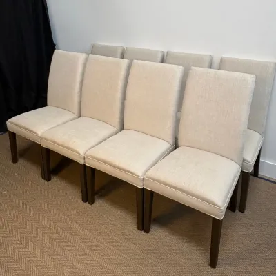 Sale Photo Thumbnail #38: Set of eight contemporary dining chairs upholstered in a neutral beige linen-look fabric with dark wood legs.