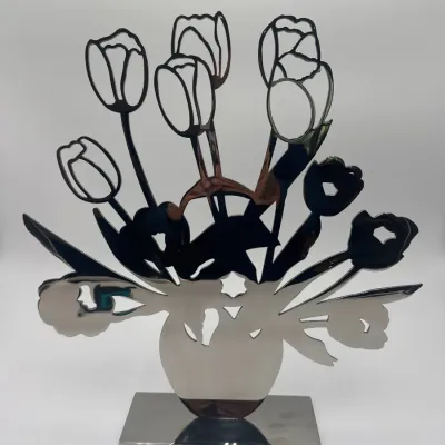 Sale Photo Thumbnail #40: Modernist polished chrome tabletop sculpture depicting a bouquet of tulips in a vase, mounted on a rectangular base.