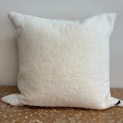 Sale Photo Thumbnail #58: Square throw pillow featuring a soft, white faux-shearling or sherpa texture, shown in clean condition.