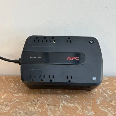 Sale Photo Thumbnail #116: APC Back-UPS 550 uninterruptible power supply and surge protector, showing minor surface wear.
