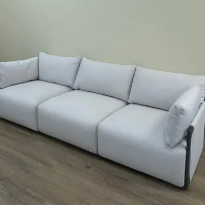 Sale Photo Thumbnail #35: Modern three-seat sofa with light gray fabric upholstery and a dark metal frame, featuring plush cushions and arm pillows.