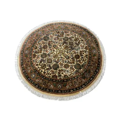 Sale Photo Thumbnail #293: Round Persian-style area rug featuring an intricate floral design in earth tones with a fringed border.