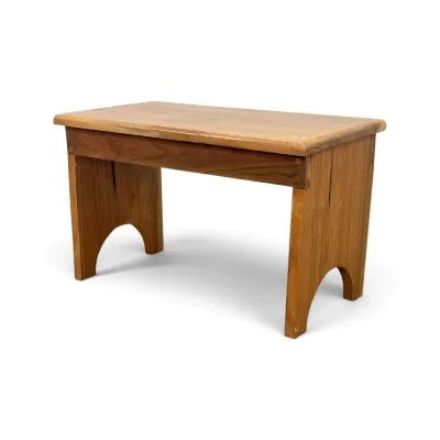 Sale Photo Thumbnail #184: Rustic wooden bench or low table featuring arched side supports and a natural finish.
