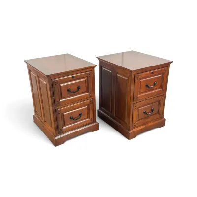 Sale Photo Thumbnail #126: Pair of traditional cherry wood two-drawer filing cabinets featuring paneled sides, bracket feet, and dark metal bail pulls.