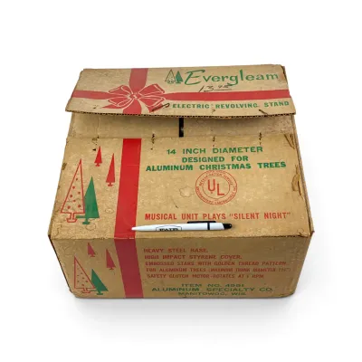 Sale Photo Thumbnail #29: Vintage Evergleam electric revolving stand for aluminum Christmas trees, in its original cardboard box, circa 1960s.