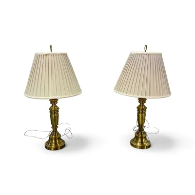 Sale Photo Thumbnail #188: Pair of vintage brass table lamps featuring baluster-style bases and pleated cream fabric shades.