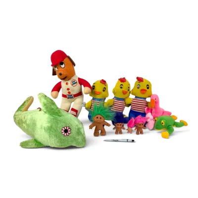 Sale Photo Thumbnail #20: Collection of vintage plush toys and troll dolls, including a Dakin baseball dog, yellow chicks, a green dolphin, and various Russ troll figures.