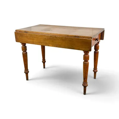 Sale Photo Thumbnail #16: Antique American drop-leaf table in a warm pine finish, featuring turned legs and a single end drawer with a wooden pull.
