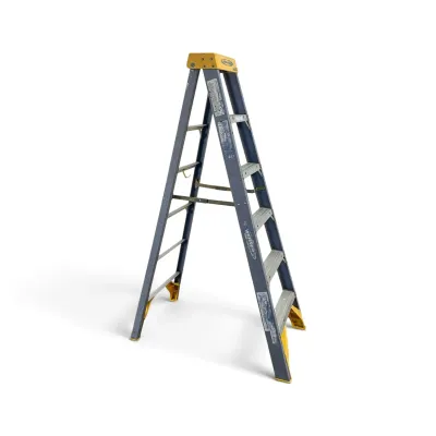 Sale Photo Thumbnail #223: Werner blue fiberglass 6-foot step ladder with a yellow plastic top cap and feet, showing some wear from use.