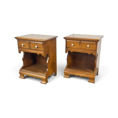Sale Photo Thumbnail #103: Pair of vintage Early American style maple nightstands, featuring a single drawer with white ceramic pulls above an open storage cubby and scalloped apron details.