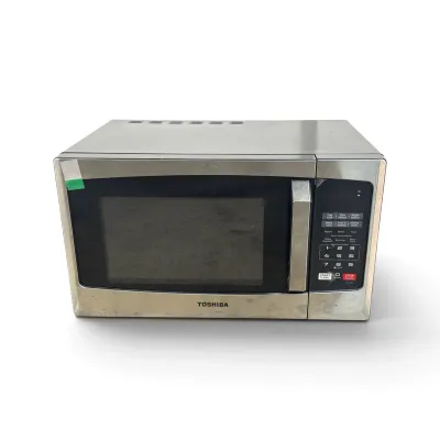 Sale Photo Thumbnail #113: Toshiba countertop microwave oven with a stainless steel finish and digital control panel, showing some light surface wear.