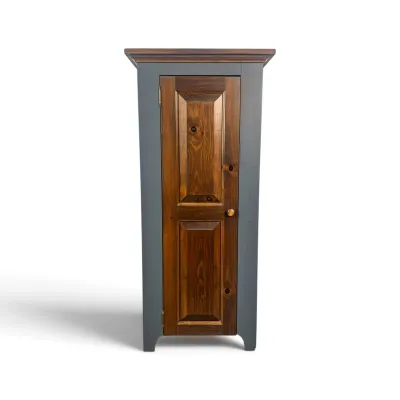 Sale Photo Thumbnail #212: Rustic pine jelly cupboard featuring a painted slate gray frame, a natural wood-stained door with raised panels, and a simple wooden knob.