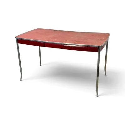 Sale Photo Thumbnail #157: Vintage mid-century formica kitchen table with a red top, metal trim, and chrome legs, showing significant wear and patina.