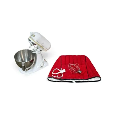 Sale Photo Thumbnail #314: White KitchenAid Ultra Power tilt-head stand mixer with a stainless steel bowl, flat beater, wire whip, and a red quilted fabric cover.