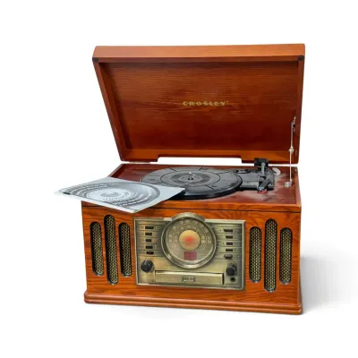Sale Photo Thumbnail #172: Crosley retro-style turntable and radio system in a wooden cabinet, featuring a built-in CD player and vintage-inspired dial interface.