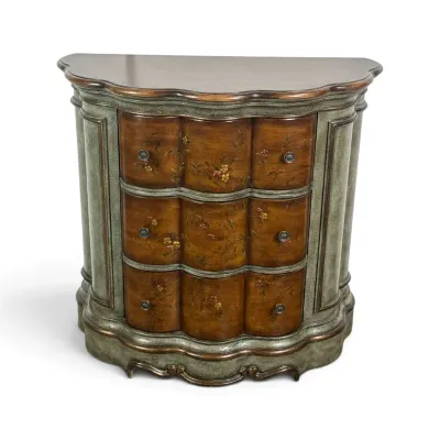 Sale Photo Thumbnail #93: Traditional demilune chest featuring a hand-painted floral design on three serpentine drawers, framed by a distressed sage green and gold-trimmed cabinet.