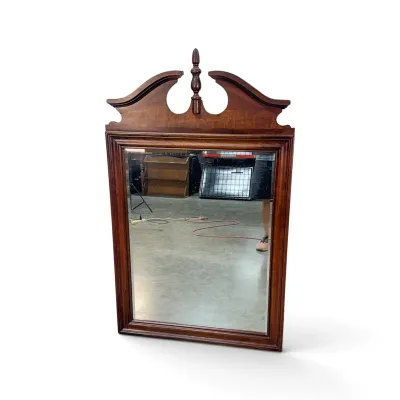Sale Photo Thumbnail #174: Chippendale-style mahogany wall mirror featuring a broken pediment top with a central turned finial.