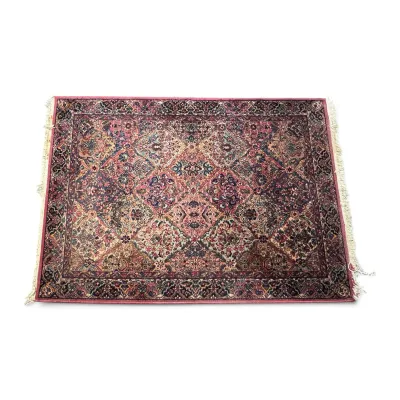 Sale Photo Thumbnail #299: Intricately patterned Persian-style area rug featuring a dense floral and geometric design in shades of pink, burgundy, and cream, finished with a fringed border.