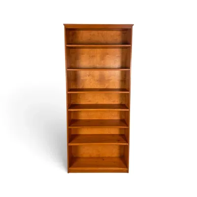 Sale Photo Thumbnail #272: Tall pine wood bookcase featuring seven spacious shelves and a warm honey finish.