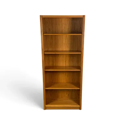 Sale Photo Thumbnail #271: Tall oak bookcase featuring five spacious shelves and a warm, natural wood grain finish.