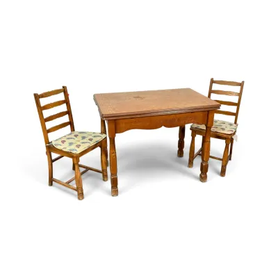 Sale Photo Thumbnail #310: Vintage wooden dining set featuring a rectangular table with turned legs and two ladder-back chairs with patterned seat cushions, showing moderate wear and age.