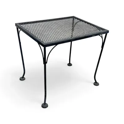 Sale Photo Thumbnail #196: Vintage black wrought iron patio side table featuring a mesh top and curved legs.