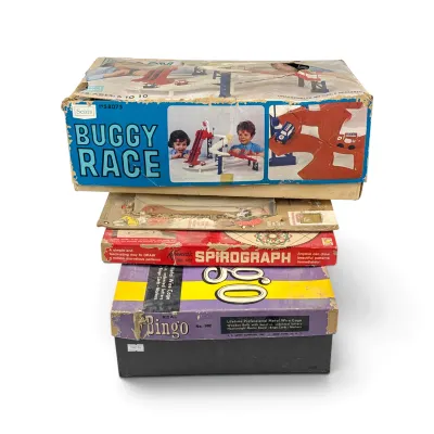 Sale Photo Thumbnail #23: Stack of vintage board games and toys, including a Sears Buggy Race game, Kenner's Spirograph, and a Real Bingo set, showing significant wear and tear on the boxes.