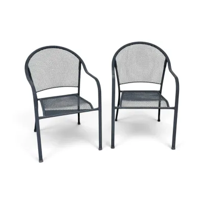 Sale Photo Thumbnail #253: Pair of black powder-coated mesh metal patio armchairs with rounded backs.