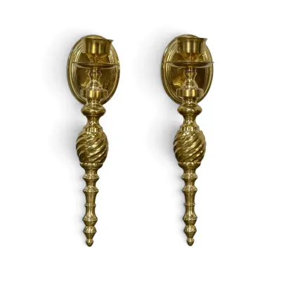 Sale Photo Thumbnail #325: Pair of vintage brass wall sconce candle holders featuring a spiral-twisted center and a tapered, tiered finial design.