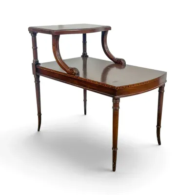 Sale Photo Thumbnail #49: Vintage mahogany two-tier step table featuring inlaid banding, curved supports, and turned legs.