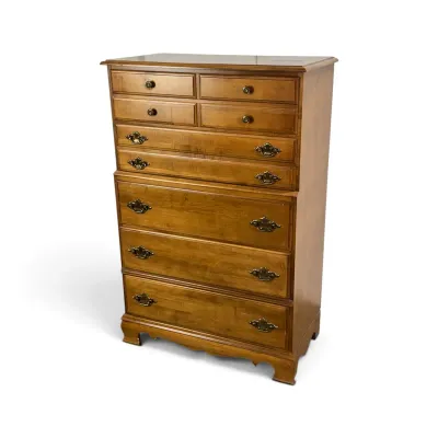 Sale Photo Thumbnail #4: Vintage Ethan Allen maple chest-on-chest dresser featuring nine drawers with brass batwing pulls and bracket feet.