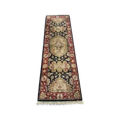 Sale Photo Thumbnail #283: Traditional Persian-style runner rug featuring a central medallion design in gold, black, and red tones with fringed ends.