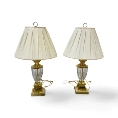 Sale Photo Thumbnail #189: Pair of vintage brass and cut crystal table lamps with pleated cream fabric shades, featuring neoclassical style bases.