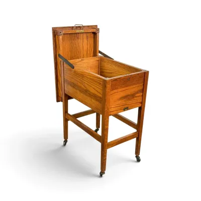 Sale Photo Thumbnail #65: Antique oak washstand or dough box on casters, featuring a hinged lid that opens to reveal a deep storage compartment.