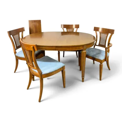 Sale Photo Thumbnail #141: Neoclassical style cherry dining set featuring an extendable round table and four matching chairs with cane backs and light blue upholstered seats.