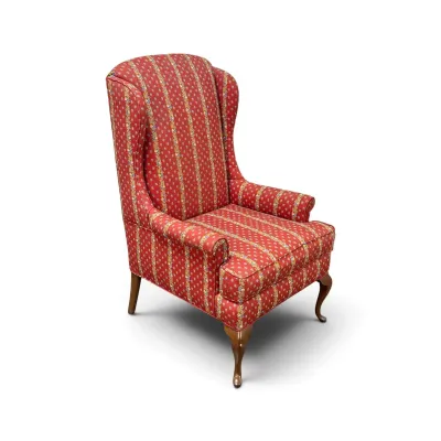 Sale Photo Thumbnail #151: Vintage wingback armchair upholstered in a red, gold, and blue striped floral fabric, featuring cabriole front legs and straight back legs.