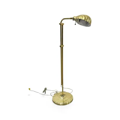 Sale Photo Thumbnail #153: Vintage brass pharmacy-style floor lamp featuring an adjustable height pole, a fluted round base, and a shell-shaped shade.