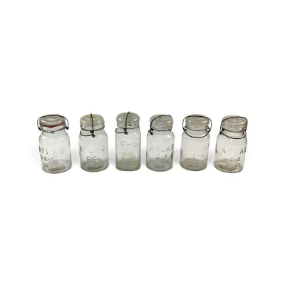 Sale Photo Thumbnail #36: Collection of six vintage Atlas E-Z Seal clear glass canning jars with wire bail closures and glass lids.