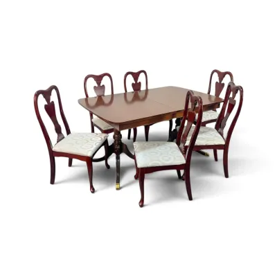 Sale Photo Thumbnail #145: Chippendale-style mahogany dining set featuring a double-pedestal table and six splat-back chairs with upholstered seats.