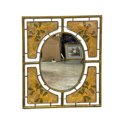 Sale Photo Thumbnail #322: Art Nouveau style wall mirror featuring an oval center glass surrounded by a faux-bamboo metal frame and four corner panels decorated with dragonfly motifs.