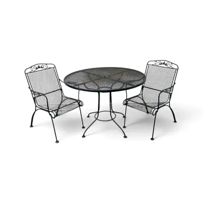 Sale Photo Thumbnail #228: Vintage black wrought iron patio set including a round mesh-top table and two matching mesh armchairs with decorative scrollwork.