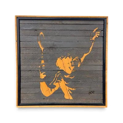 Sale Photo Thumbnail #176: Handcrafted wooden wall art depicting a tennis player serving, constructed from reclaimed wood slats with a natural and dark-stained finish.
