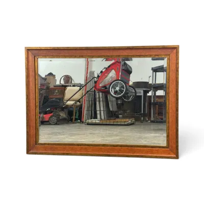 Sale Photo Thumbnail #117: Large rectangular wall mirror featuring a beveled edge and a two-tone wooden frame with a warm cherry finish and a gold-painted inner border.