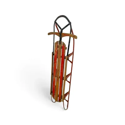 Sale Photo Thumbnail #128: Vintage Cyclone wooden snow sled with red painted slats and metal runners, showing moderate wear from age and use.