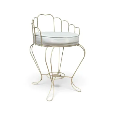 Sale Photo Thumbnail #190: Vintage mid-century wrought iron vanity stool with a scalloped backrest, curved legs, and a white vinyl cushion.