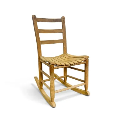 Sale Photo Thumbnail #75: Vintage wooden rocking chair featuring a ladder-back design and a contoured, slatted seat with a natural worn finish.