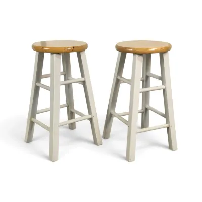 Sale Photo Thumbnail #76: Pair of wooden bar stools featuring natural wood round seats and off-white painted legs with double rungs.